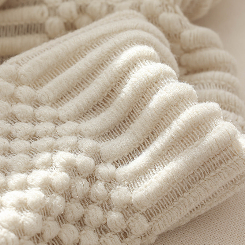 Strickdecke mit Fransen – Weiche Wohndecke im modernen Strukturdesign