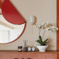 Minimalist Abstract Round Wall Mirror with Decorative Accent